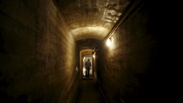 A man walks through a tunnel, which is part of the Nazi Germany Riese construction project, under the Ksiaz castle in an area where a Nazi train is believed to be.
