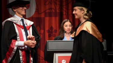 Here to help: Name reader Dr Fiona Price behind the lectern at one of Swinburne University's graduation ceremonies at Melbourne Convention and Exhibition Centre.