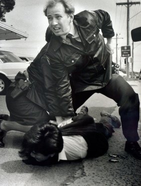 1992 Victoria police constable Glenn Pullin arrests a man outside the Roller skating rink in Noble Park. 