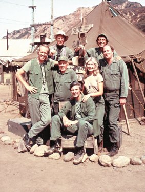 David Stiers as Major Winchester (right) with the rest of the M*A*S*H cast.