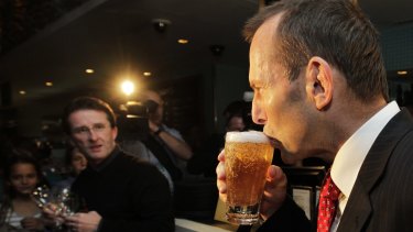 Tony Abbott enjoys a beer during his time as opposition leader.