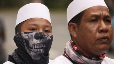 A youth wears a mask during a protest earlier this month against Jakarta governor Basuki Tjahaja Purnama, popularly known as Ahok.