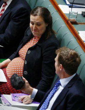 Kelly O'Dwyer, Minister for Revenue and Financial Services, was apparently less keen to hold the lump of coal proffered by Minister for Social Services Christian Porter.