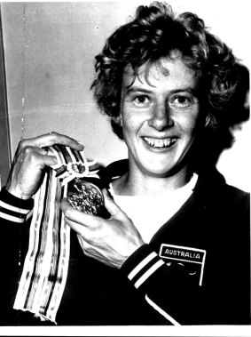 Betty Cuthbert with her gold medal from the Tokyo Olympics.