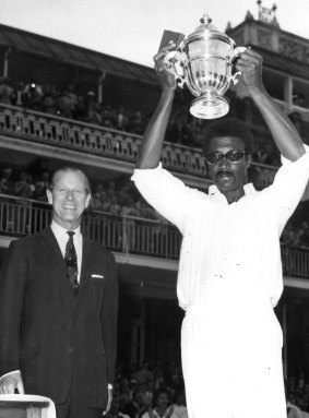 Clive Lloyd is presented the 1975 World Cup by Prince Phillip.