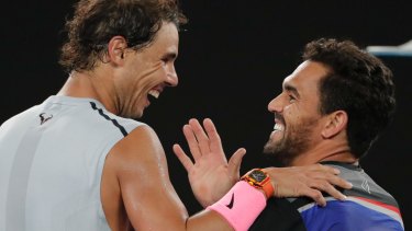 Nadal is congratulated by Victor Estrella Burgos during their first round match at the Australian Open.
