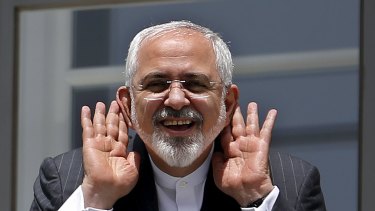 Iranian Foreign Minister Mohammad Javad Zarif gestures as he talks with journalists in Vienna where the deal was reached. 