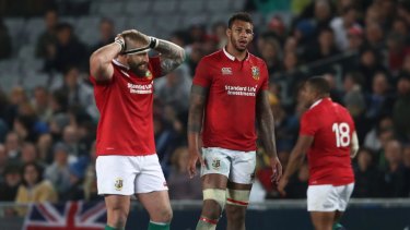 Red alert: Courtney Lawes of the British and Irish Lions and teammates come to terms with defeat against the Blues at Eden Park.