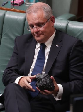 Treasurer Scott Morrison with a lump of coal during question time.