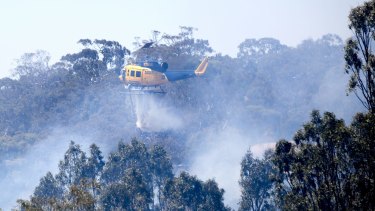 A helicopter helps the effort to control a fire in Sunbury on Christmas Day.