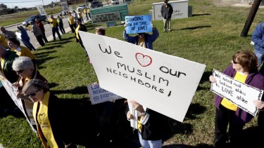 Members of several Unitarian Universalist churches and the Unitarian Voices for Justice group showed their support for Muslims Webster, Texas, on Friday.