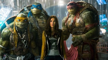 Megan Fox as April O'Neil with her sidekicks  in Teenage Mutant Ninja Turtles: Out of the Shadows.