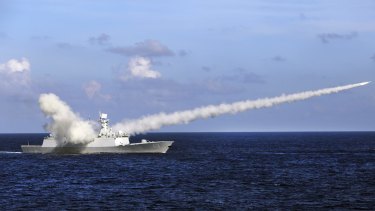 Wrong way, go back: A Chinese frigate launches an anti-ship missile during military exercises in the South China Sea.