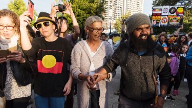 Clinton Pryor walking into The Block in Redfern where he was greeted by the community. 