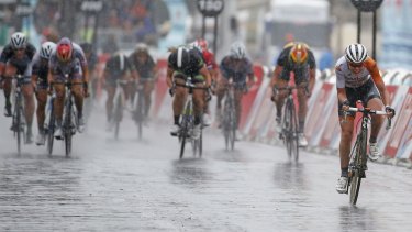 Rabo Liv's Dutch rider Anna van der Breggen holds of the pack to win the La Course By Le Tour De France Women's race on a wet Champs-Elysees yesterday.