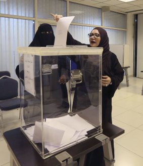 Saudi women vote at a polling center during the country's municipal elections in Riyadh, Saudi Arabia.
