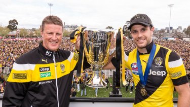 Tigers coach Damien Hardwick and captain Trent Cotchin with the cup at Punt Road Oval.