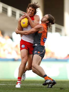 Tough to replace: Kurt Tippett is tackled by Callan Ward during the 2016 AFL First Qualifying Final between the Sydney Swans and the GWS Giants at ANZ Stadium.