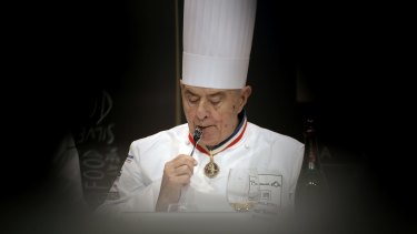 Paul Bocuse tastes a dish during the "Bocuse d'Or" (Golden Bocuse) trophy, at the 14th World Cuisine contest, in Lyon, in 2013.