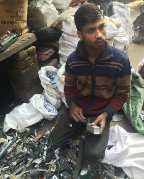 Imran Mansoori, sorting e-waste in Shastri Park, Delhi.