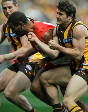 Hawthorn's Campbell Brown crunches Sydney's Michael O'Loughlin.