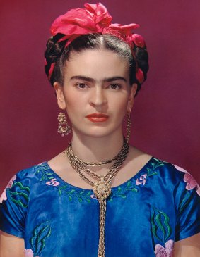 Frida Kahlo in blue satin blouse, cira 1939. Photograph by Nickolas Muray.