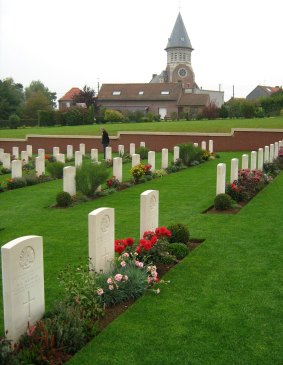 Fromelles (Pheasant Wood) Cemetery, France, with the village church in the background.