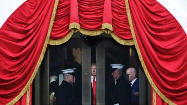 Donald Trump waits to step out onto the portico for his inauguration on January 20, 2017.