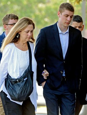 Brock Turner, right, attends court. 