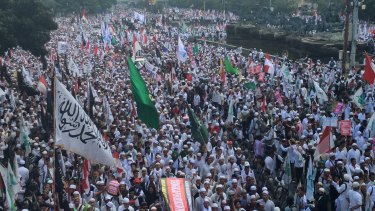 Demonstrators rallied in Jakarta after Friday prayers to demand the arrest of the city's governor, Ahok.