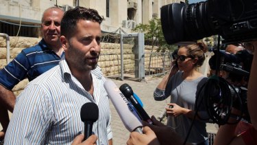 Lebanese father Ali Elamine speaks to journalists after dropping charges against his estranged wife and the <i>60 Minutes</i> crew.