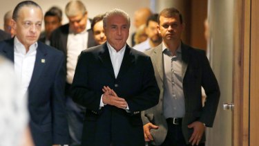 Michel Temer arrives to deliver his new statement, in which he called leading Brazilian businessman Joesley Batista a 'criminal' and a 'windbag'.