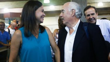 Opposition leader Maria Corina Machado, left, welcomes former Colombian president Andres Pastrana, at the International airport as several former Latin America leaders arrived on Saturday in support of Sunday's plebiscite. 