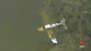 The plane managed to avoid trees and land in the water at Liverpool Golf Club.