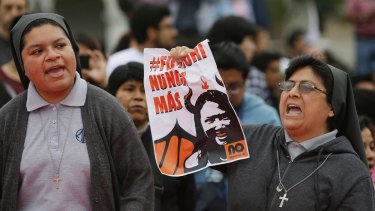 Nuns shouts slogans against Keiko Fujimori, daughter of jailed former president Alberto Fujimori, blaming her party for corruption charges against current President Pedro  Kuczynski.
