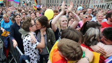 Supporters celebrate outside Dublin Castle following the announcement of the result of the same-sex marriage referendum in Dublin on Saturday.