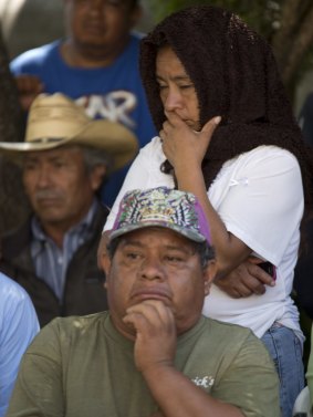 Worst fears: Relatives of the missing students attend a press conference.