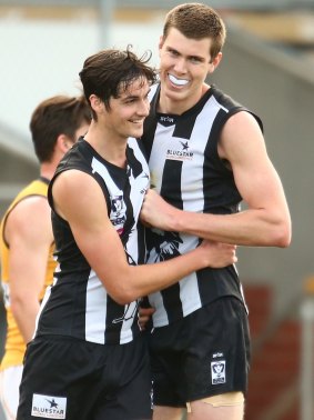 Tall order: Mason Cox celebrates with Ash Close after scoring in the VFL.