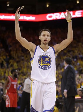 Fan favourite: Warriors guard Stephen Curry interacts with the Oakland crowd.