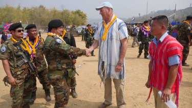 Mr Simpkins greets Karen guerrillas at their Revolution Day event in Myanmar.