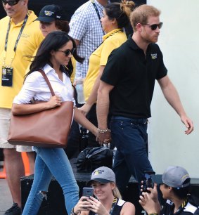 Prince Harry and his girlfriend Meghan Markle arrive at a wheelchair tennis event at the Invictus Games in Toronto, Monday, Sept. 25, 2017.