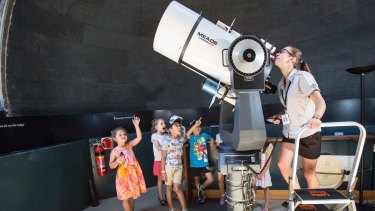 Sydney Observatory tour guide Kirsten Banks says the school holiday program usually attracts hundreds of families.