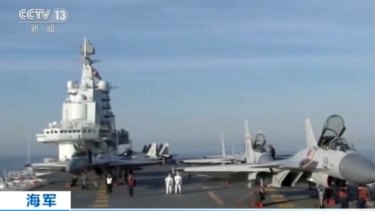 In this video still, China's aircraft carrier Liaoning is seen during live-ammunition drills in the waters of the Bohai Sea in northern China. 
