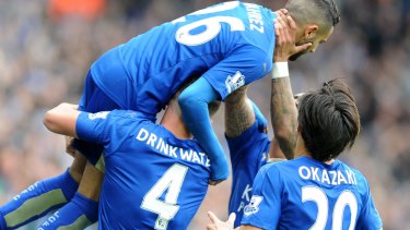 Fairytale: Leicester's Riyad Mahrez, top, celebrates after scoring against Swansea City. 