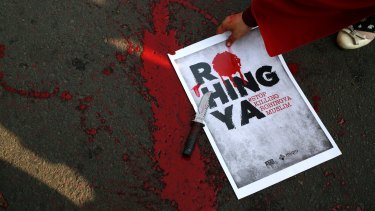 A poster with fake blood after a theatrical performance in Jakarta on Sunday depicting the violence against Muslim Rohingya in Myanmar.