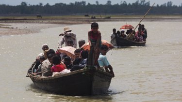 Members of Myanmar's Rohingya ethnic minority after crossing over to the Bangladesh side of the border on Saturday.