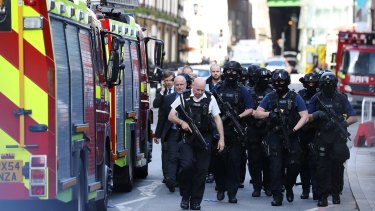 Counter-terrorism officers march near the scene of the London Bridge attack. 