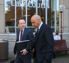 Moses Obeid, right, leaves the Federal Court.