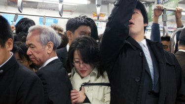 The big squeeze on a Tokyo subway train during morning peak hour. 