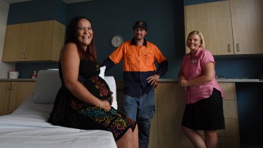 Kelly Jenkins with her partner James Burns and midwife Vanessa Smith.